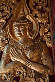 Wat Xieng Thong temple in Luang Prabang, Laos. the Ho Tai, the library. Detail of the console of the roof. 